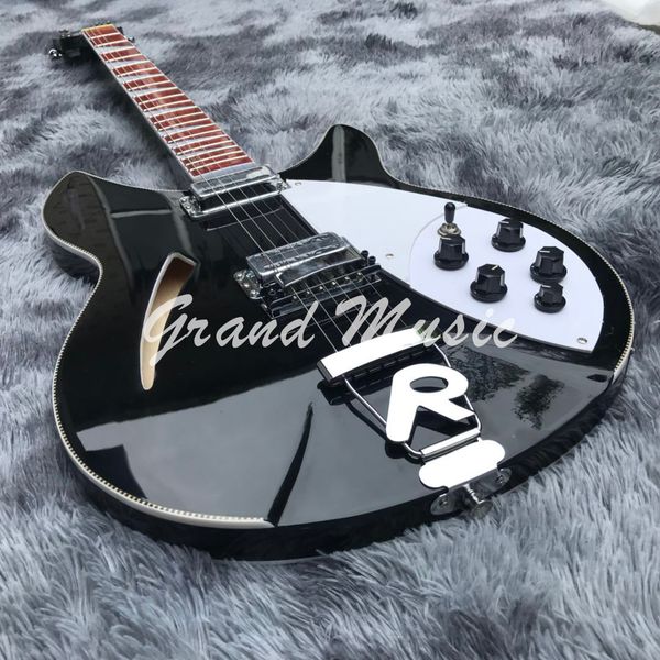custom semi f hole hollow body ricken 360 electric guitar in black color all color are oem available
custom semi f hole hollow body ricken 360 electric guitar in black color all color are oem available