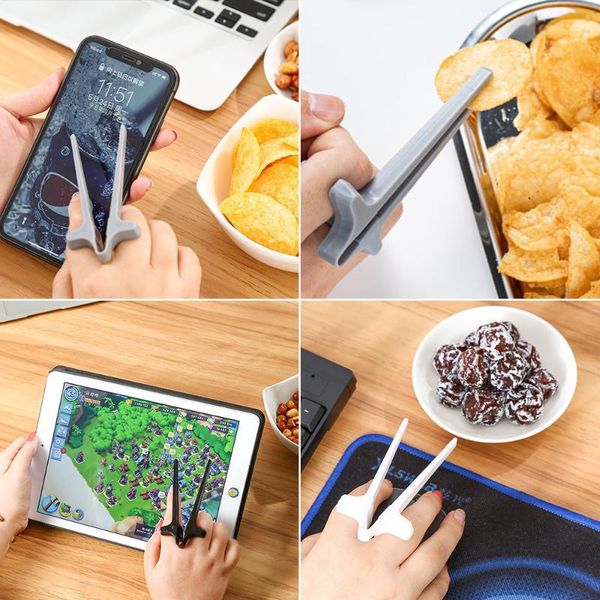 chopsticks lazy snack play games finger assistant clip not dirty hand phone accessory kitchen tool.
chopsticks lazy snack play games finger assistant clip not dirty hand phone accessory kitchen tool.