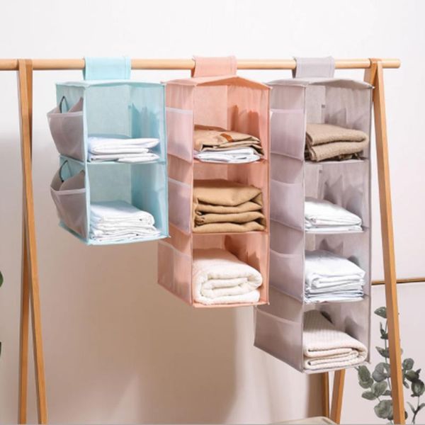 storage bags hanging wardrobe rack fabric folded with side pockets for storing items
storage bags hanging wardrobe rack fabric folded with side pockets for storing items