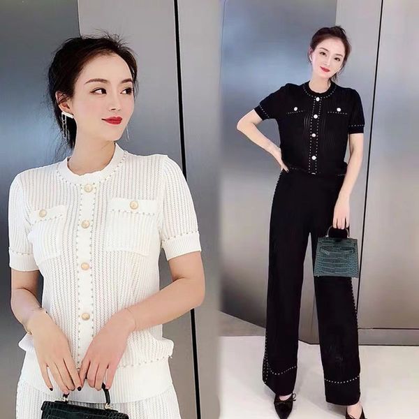 women golden button hollow out knitting +wide leg pants 2pcs sets casual short sleeve knitwear trousers suit 210522, White
women golden button hollow out knitting +wide leg pants 2pcs sets casual short sleeve knitwear trousers suit 210522, White