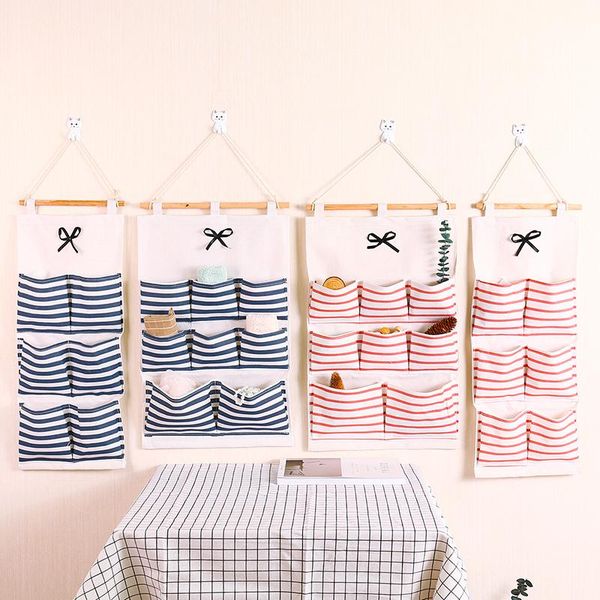 storage bags wall-mounted cotton linen hanging bag multi-pockets washable stripe multi-layer organizer on walls behind doors
storage bags wall-mounted cotton linen hanging bag multi-pockets washable stripe multi-layer organizer on walls behind doors