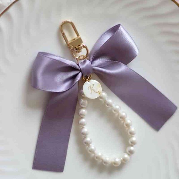 hand made lovely dreamy girl fritillary pearl letter small key chain mobile phone pendant bow, Silver
hand made lovely dreamy girl fritillary pearl letter small key chain mobile phone pendant bow, Silver
