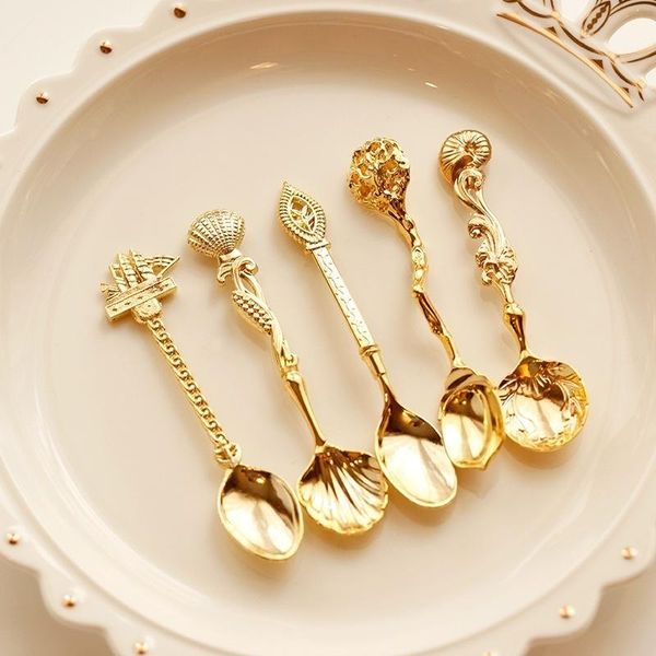spoons european and american retro coffee spoon dessert small golden conch shell sailboat five-piece set
spoons european and american retro coffee spoon dessert small golden conch shell sailboat five-piece set