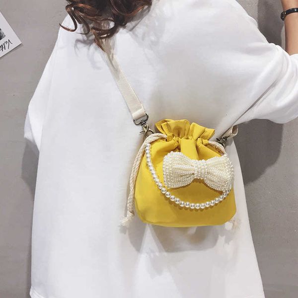 small bag girl 2021 sweet pearl bow versatile one shoulder bucket girl's msenger bag fashion
small bag girl 2021 sweet pearl bow versatile one shoulder bucket girl's msenger bag fashion