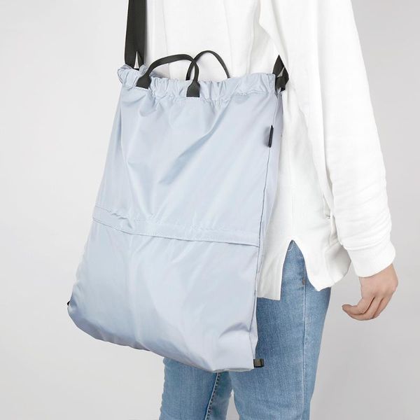 storage bags bag portable fashion bundle pocket folding travel drawstring backpack large capacity handbag shopping save a space 
storage bags bag portable fashion bundle pocket folding travel drawstring backpack large capacity handbag shopping save a space