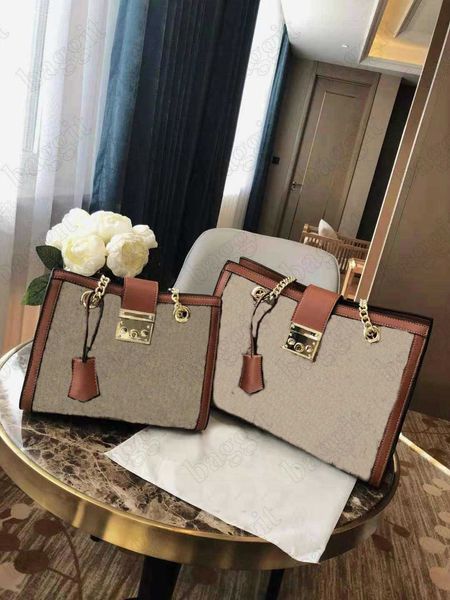 padlock small medium shoulder bag tote with a key lock closure and chain straps beige super canvas leather italy designer handbag totes
padlock small medium shoulder bag tote with a key lock closure and chain straps beige super canvas leather italy designer handbag totes