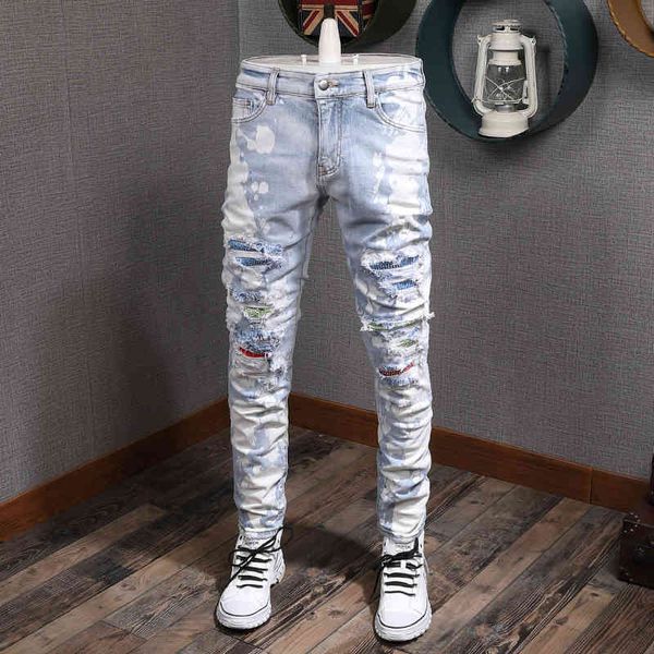 jeans fashion streetwear light blue white paint designer ripped men patchwork destroyed pencil pants hip hop jeans 
jeans fashion streetwear light blue white paint designer ripped men patchwork destroyed pencil pants hip hop jeans