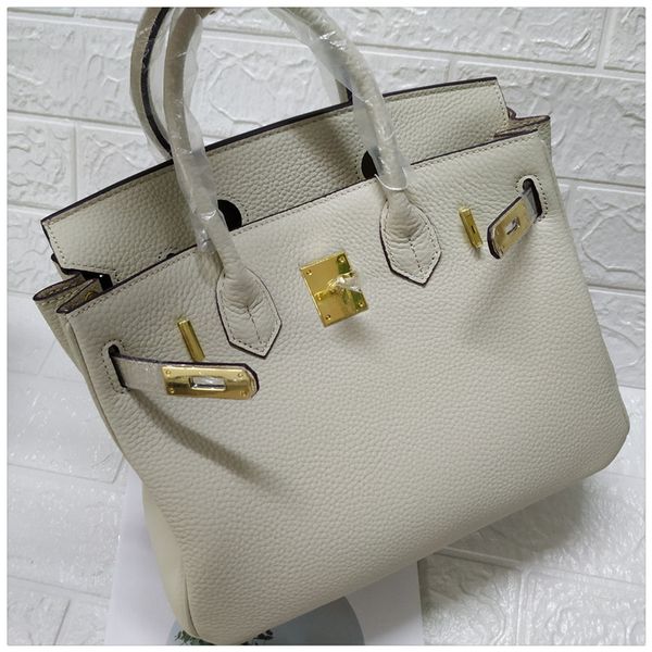design handbag 2020 new layer cow milkshake white bill of lading shoulder fashion versatile leather buckle women's bag
design handbag 2020 new layer cow milkshake white bill of lading shoulder fashion versatile leather buckle women's bag