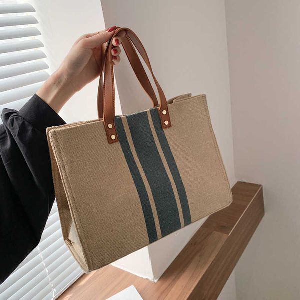 korean women's hand-held briefcase profsional commuting stripe simple one shoulder large capacity canvas bag
korean women's hand-held briefcase profsional commuting stripe simple one shoulder large capacity canvas bag