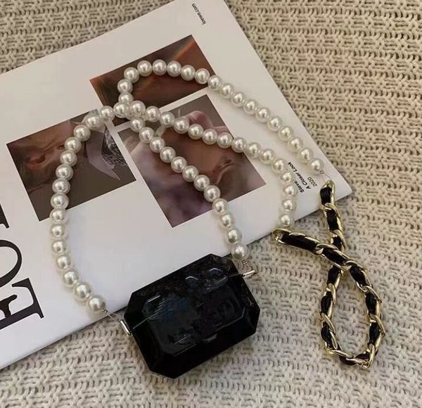 pearl handbag fashion trend necklace acrylic earphone bag minimalist mini diagonal chain bag, Black
pearl handbag fashion trend necklace acrylic earphone bag minimalist mini diagonal chain bag, Black
