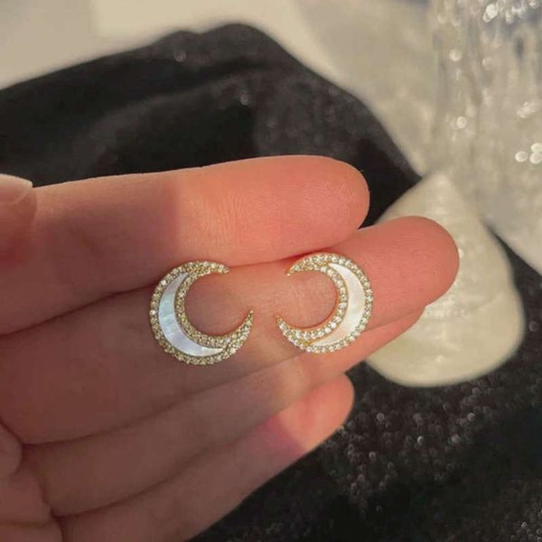 s925 silver needle french micro inlaid zircon shell moon women's simple temperament cold wind earrings, Black
s925 silver needle french micro inlaid zircon shell moon women's simple temperament cold wind earrings, Black