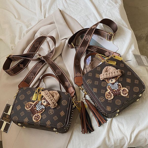 Wholesale factory ladies leather shoulder bag Hong Kong wind classic printed handbags street personalized rivet handbag sweet cute cartoon bear women backpack, Coffee1-1820
Wholesale factory ladies leather shoulder bag Hong Kong wind classic printed handbags street personalized rivet handbag sweet cute cartoon bear women backpack, Coffee1-1820