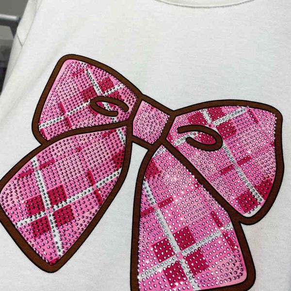 pure yuan designer 2022 summer version new age reducing girls' diamond bow round neck short sleeve white t-shirt
pure yuan designer 2022 summer version new age reducing girls' diamond bow round neck short sleeve white t-shirt