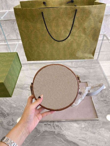 women's designer almond cloth material brown round cake one-shoulder messenger bag size 17cm
women's designer almond cloth material brown round cake one-shoulder messenger bag size 17cm