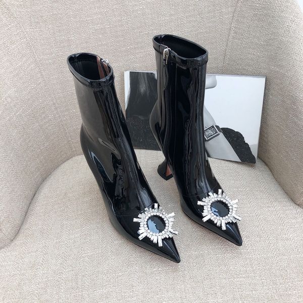 amina muaddi black patent ankle boots sun buckled cubic stiletto heel pointed toes side zipper leather sole booties for women luxury designe
amina muaddi black patent ankle boots sun buckled cubic stiletto heel pointed toes side zipper leather sole booties for women luxury designe