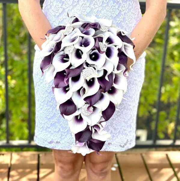 wedding flowers waterfall white purple bridal bouquet for bride cala lily cascading holding bridesmaid brooch elegant
wedding flowers waterfall white purple bridal bouquet for bride cala lily cascading holding bridesmaid brooch elegant