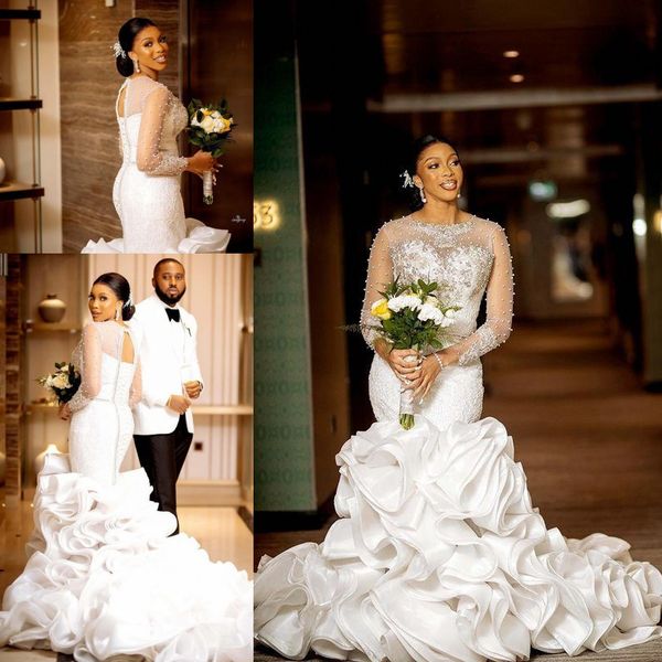 luxury pearls mermaid wedding dresses 2022 illusion long sleeve sheer o-neck ruffles wave cathedral train african lace-up bridal dress, White
luxury pearls mermaid wedding dresses 2022 illusion long sleeve sheer o-neck ruffles wave cathedral train african lace-up bridal dress, White