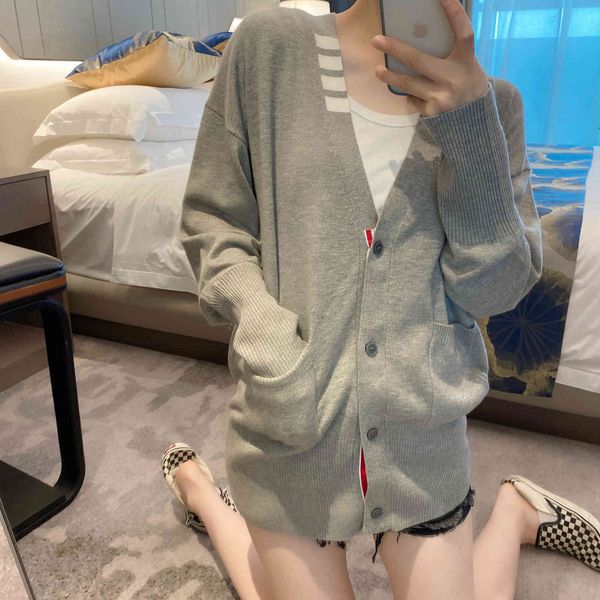 2021 early autumn new collar edge four bar stripe men's women's knitted medium and long cardigan coat, White
2021 early autumn new collar edge four bar stripe men's women's knitted medium and long cardigan coat, White