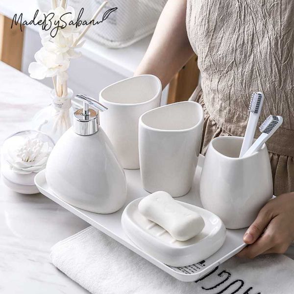 bathroom accessories five-piece set ceramic soap dispenser toothbrush holder mouthwash cup bath bottle toilet kit accessory 
bathroom accessories five-piece set ceramic soap dispenser toothbrush holder mouthwash cup bath bottle toilet kit accessory