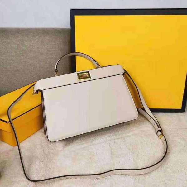 bag continuation of the trapezoid silhouette and square twist lock design of the classic peekaboo handbag
bag continuation of the trapezoid silhouette and square twist lock design of the classic peekaboo handbag