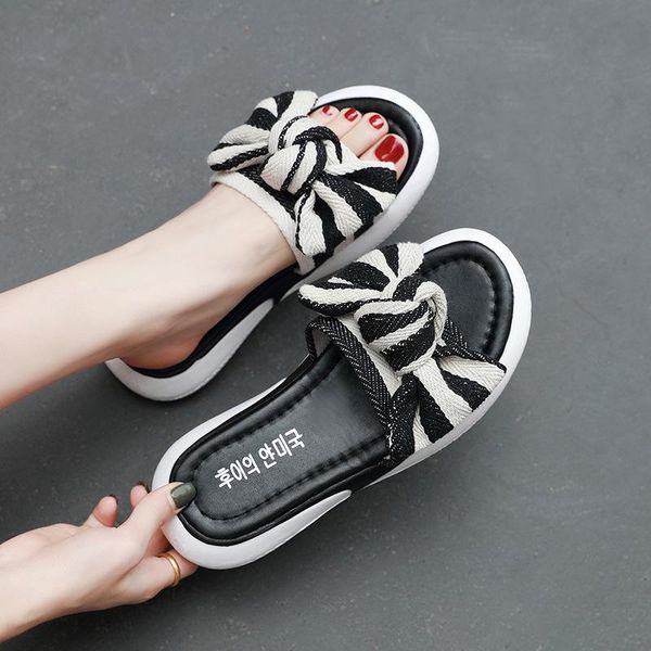 slippers summer female foreign trade large size flip-flop korean edition bow knot students wear flat heel beach shoes outside leisure, Black
slippers summer female foreign trade large size flip-flop korean edition bow knot students wear flat heel beach shoes outside leisure, Black