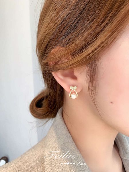 2021 new fashion niche design high level net red same bowknot pearl earrings tremella nail female, Black
2021 new fashion niche design high level net red same bowknot pearl earrings tremella nail female, Black