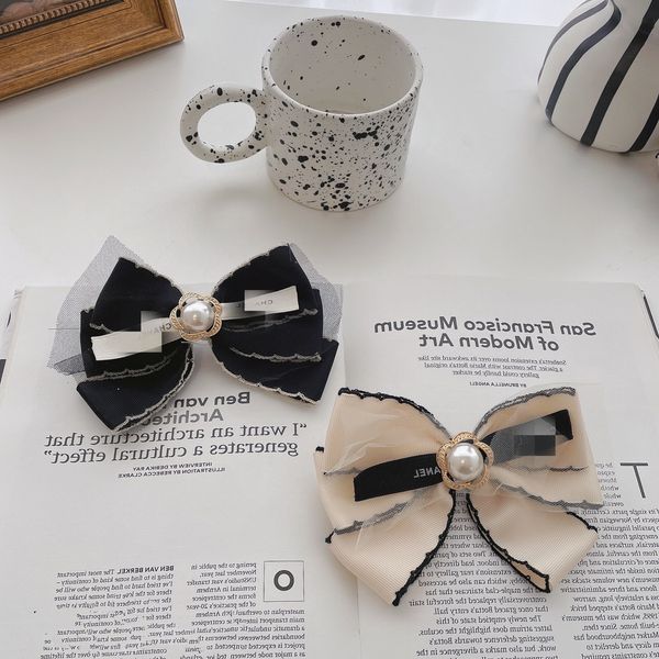 korea east gate pearl bow spring clip lovely and gentle headdress simple fashionable hair accessories, Golden;silver
korea east gate pearl bow spring clip lovely and gentle headdress simple fashionable hair accessories, Golden;silver