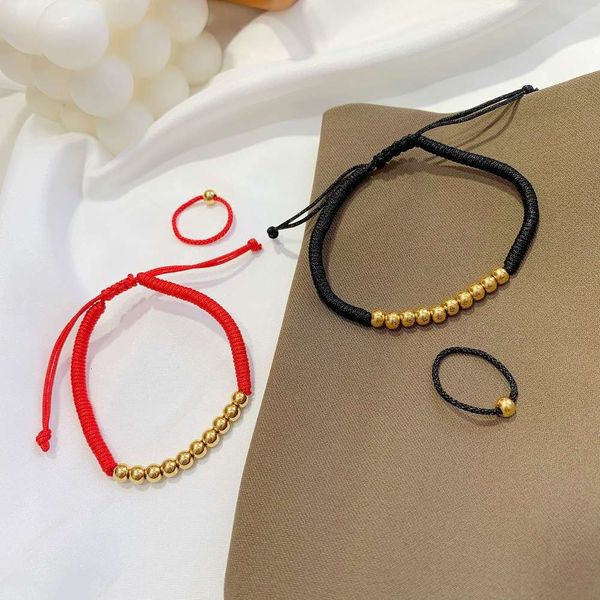hand catenary tiktok, red st black rope, golden bean, gold chain bracelet, female no color, beads, hand, ring, ring.
hand catenary tiktok, red st black rope, golden bean, gold chain bracelet, female no color, beads, hand, ring, ring.