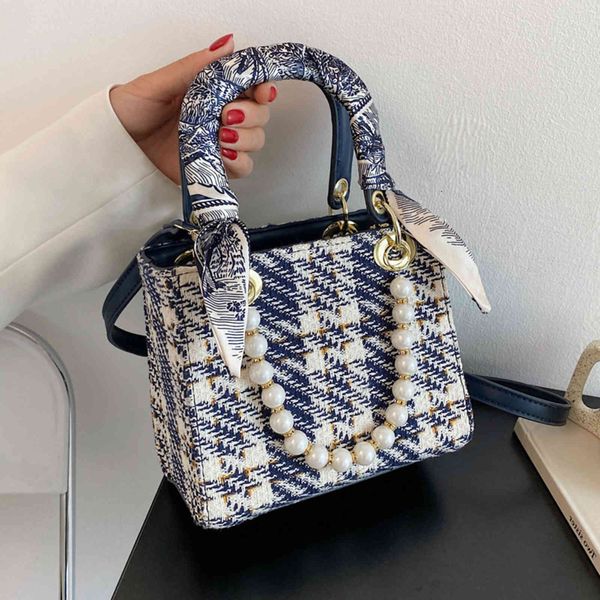 super ins 2021 fire new women's fashion color matching pearl chain hand versatile messenger princess bag
super ins 2021 fire new women's fashion color matching pearl chain hand versatile messenger princess bag