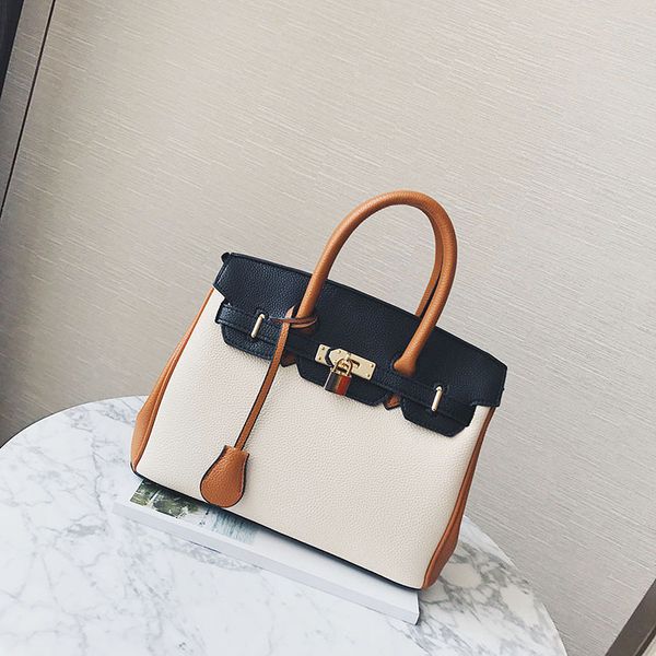 new style litchi pattern korean color contrast portable pu leather one shoulder women's bag
new style litchi pattern korean color contrast portable pu leather one shoulder women's bag