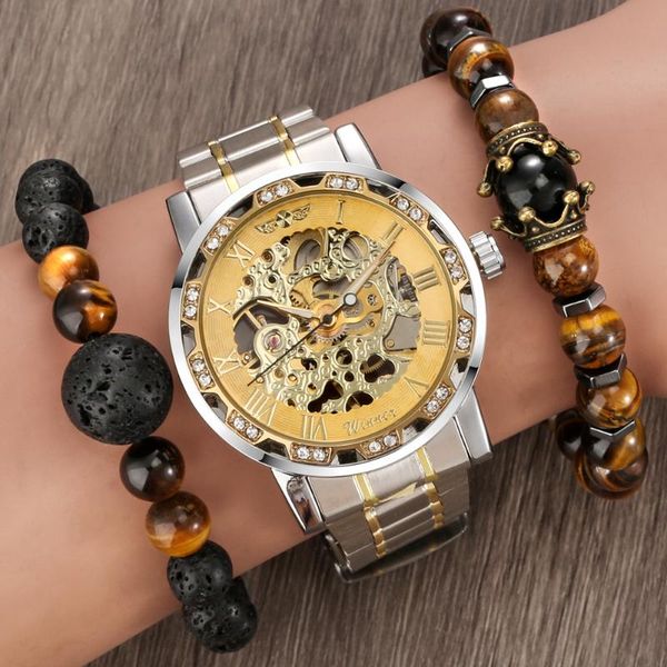 wristwatches men's gold silver steel band case golden black face white hollow rhinestone manual mechanical watch, Slivery;brown 
wristwatches men's gold silver steel band case golden black face white hollow rhinestone manual mechanical watch, Slivery;brown