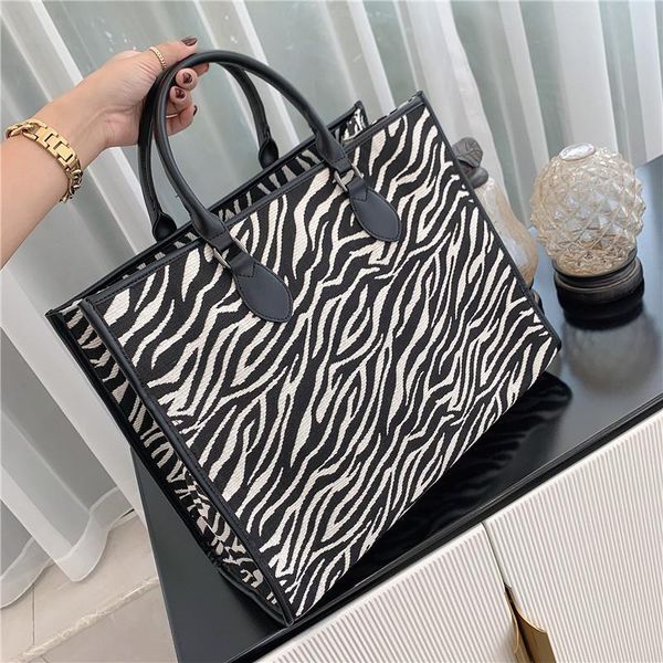 large capacity zebra bag women's 2021 temperament portable atmospheric one shoulder tote cross body
large capacity zebra bag women's 2021 temperament portable atmospheric one shoulder tote cross body