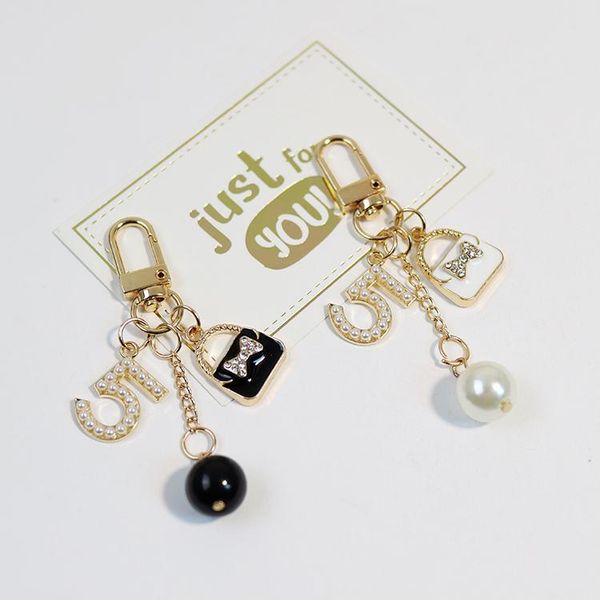 keychains fashion pearl digital with bag key chain women pendant car keyring charm gifts, Silver
keychains fashion pearl digital with bag key chain women pendant car keyring charm gifts, Silver