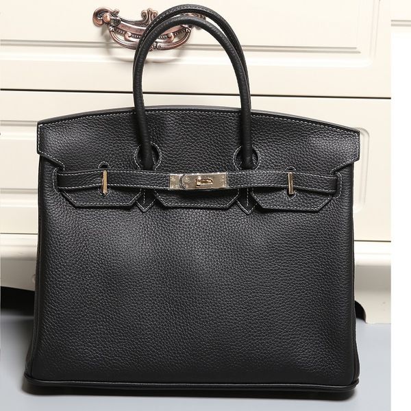 design hand women's new leather fashion layer cow hide large litchi pattern 25cm bag
design hand women's new leather fashion layer cow hide large litchi pattern 25cm bag