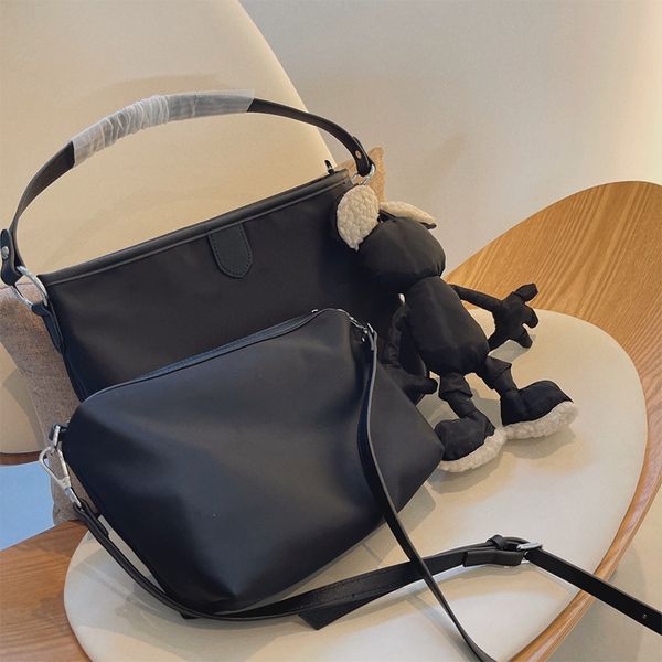 designer black shopping bags two in one handbag luxurys cartoon pendant totes
designer black shopping bags two in one handbag luxurys cartoon pendant totes