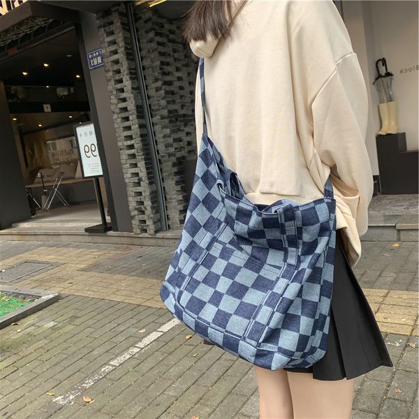female autumn and winter new korean checkered portable student simple cowboy butot bag large capacity single shoulder women's
female autumn and winter new korean checkered portable student simple cowboy butot bag large capacity single shoulder women's
