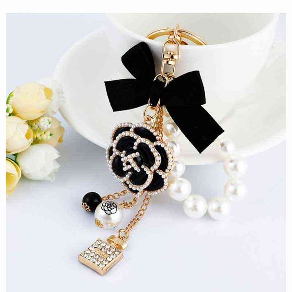 2021 luxury black camellia flower bow keychain rhinestone lock umbrella car key chain pendant for bag, Silver
2021 luxury black camellia flower bow keychain rhinestone lock umbrella car key chain pendant for bag, Silver