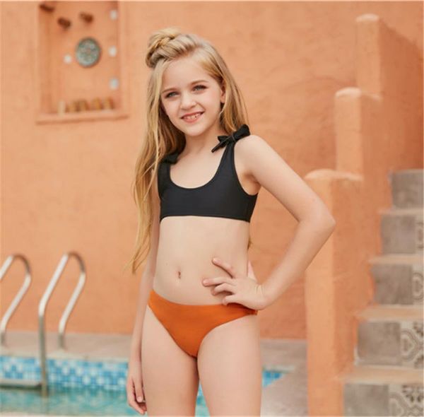 2pcs bikini swimwear kid girl fashion swimsuit bow u-shaped neck black orange triangle shorts beach swimming bathing suit one-pieces
2pcs bikini swimwear kid girl fashion swimsuit bow u-shaped neck black orange triangle shorts beach swimming bathing suit one-pieces