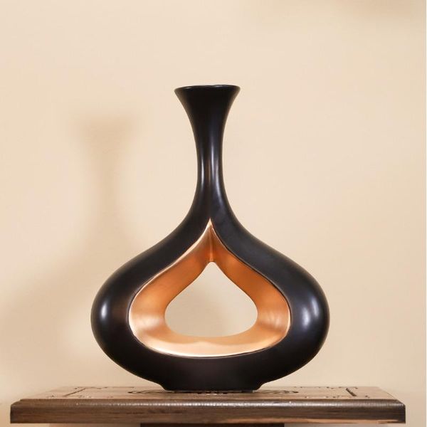 modern european ceramic black gold vase living room decoration creative hollow flower exquisite flowers home vases
modern european ceramic black gold vase living room decoration creative hollow flower exquisite flowers home vases