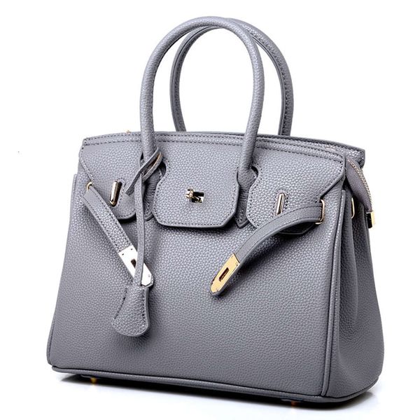 guangzhou women's bag 2021 women's fashion litchi pattern straddle one shoulder hand