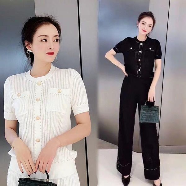 two piece dress 2021 women golden button hollow out knitting +wide leg pants 2pcs sets casual short sleeve knitwear trousers suit, White
two piece dress 2021 women golden button hollow out knitting +wide leg pants 2pcs sets casual short sleeve knitwear trousers suit, White