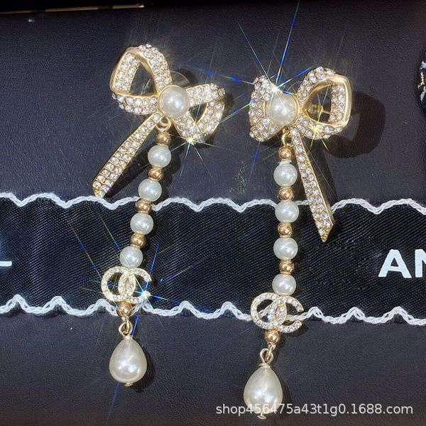 small xiangfeng temperament famous fengyuan bow water drop pearl long earrings tid0e earrings female 925 silver needle, Golden
small xiangfeng temperament famous fengyuan bow water drop pearl long earrings tid0e earrings female 925 silver needle, Golden