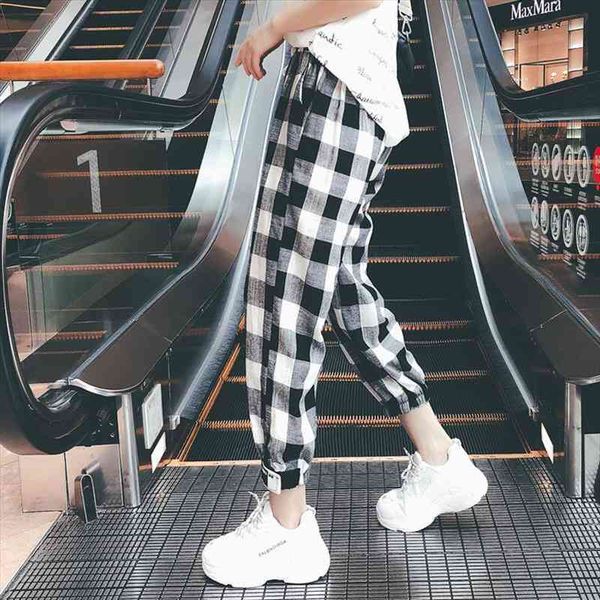 korean version autumn casual clothes women pants black white plaid harem loose drawstring trousers
korean version autumn casual clothes women pants black white plaid harem loose drawstring trousers