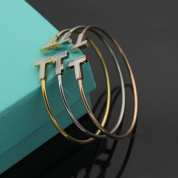 charm bracelets titanium steel jewelry wholesale double t shell bracelet women's simple smile bendable opening, Golden;silver
charm bracelets titanium steel jewelry wholesale double t shell bracelet women's simple smile bendable opening, Golden;silver
