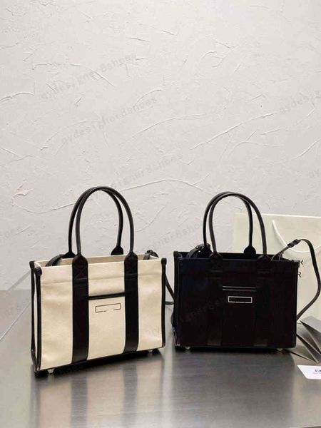 with box female designer black and white letter printing element canvas bag size 28*21cm
with box female designer black and white letter printing element canvas bag size 28*21cm