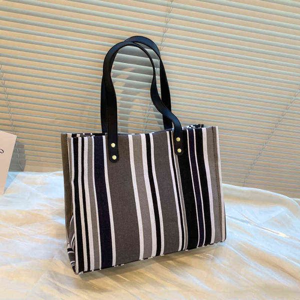 shopping bags brand designer fashion ladies leisure travel beach shoulder bag canvas striped metal buckle tote handbag for women 220309
shopping bags brand designer fashion ladies leisure travel beach shoulder bag canvas striped metal buckle tote handbag for women 220309