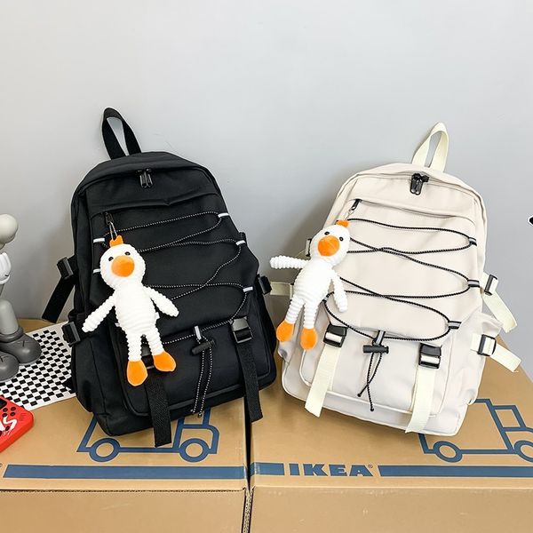 canvas fashion women's backpack cute doll pendant school bag for girls large capacity light travel
canvas fashion women's backpack cute doll pendant school bag for girls large capacity light travel