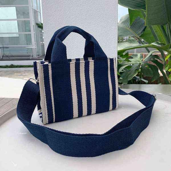 shopping bags mini canvas bag handheld one shoulder flap buckle crossbody handbags women designer tote pocket books and female 220307
shopping bags mini canvas bag handheld one shoulder flap buckle crossbody handbags women designer tote pocket books and female 220307