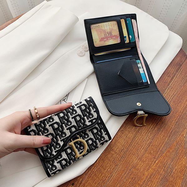 new korean printed canvas short bag zero wallet women's small folding buckle multi organ card cover, Red;black
new korean printed canvas short bag zero wallet women's small folding buckle multi organ card cover, Red;black
