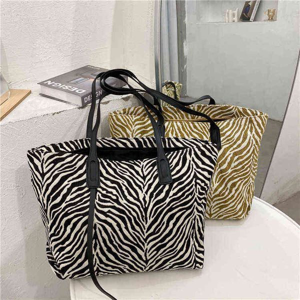 shopping bags double shoulder strap tote zebra canvas women's new college students' large capacity handbag 220307
shopping bags double shoulder strap tote zebra canvas women's new college students' large capacity handbag 220307
